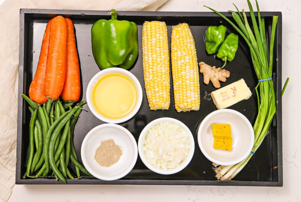 a tray with various vegetables and spices