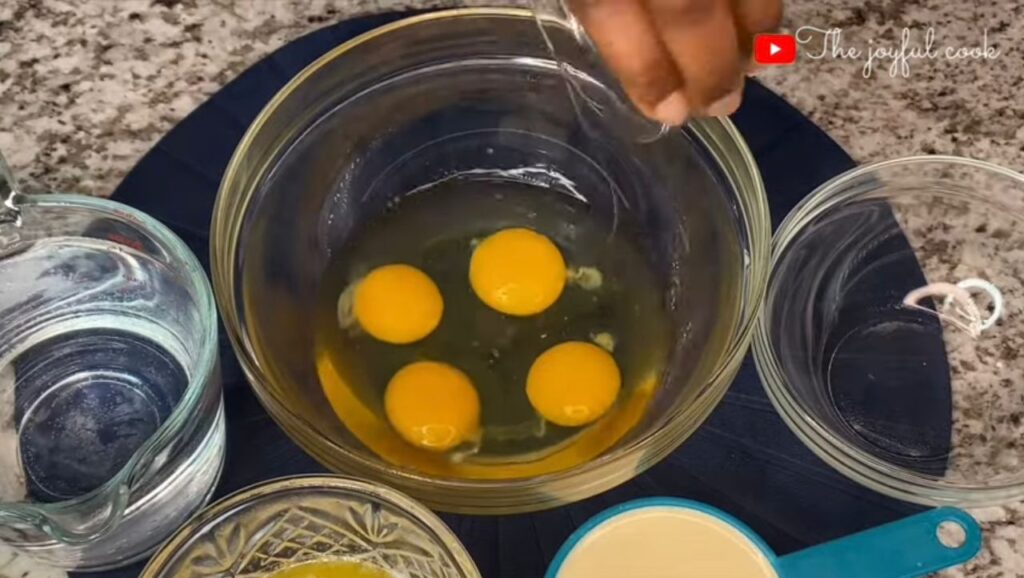 Breaking eggs in a bowl